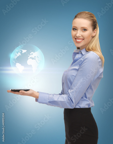Photo: woman with tablet pc and virtual earth woman with tablet pc and virtual earth