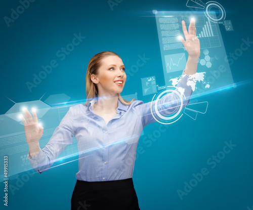 Photo: woman working with virtual screens woman working with virtual screens