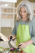 Mature woman preparing food