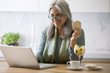 Mature woman with laptop computer