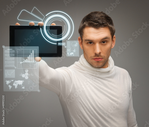 Photo: man with tablet pc and virtual screens man with tablet pc and virtual screens