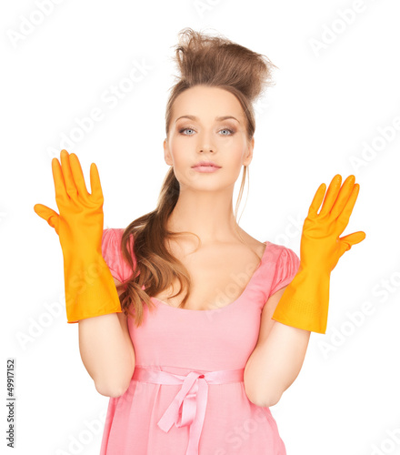 Photo: housewife with protective gloves housewife with protective gloves
