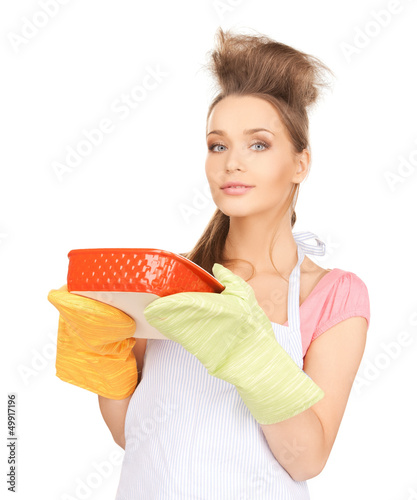 Photo: beautiful cooking housewife beautiful cooking housewife
