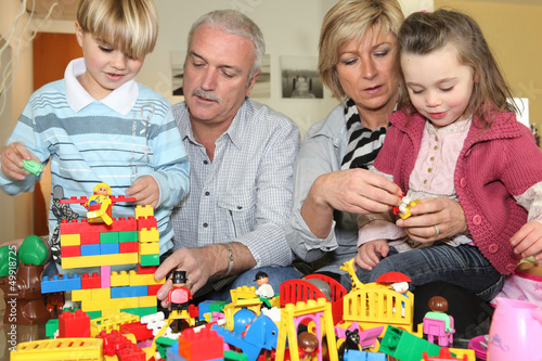 Photo: Grandparents and grandchildren playing together Grandparents and grandchildren playing together
