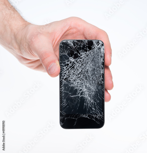 Photo: Man holding broken smartphone Man holding broken smartphone