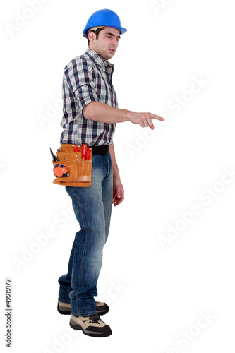 Photo: A construction worker pointing at a direction. A construction worker pointing at a direction.