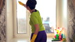 Women cleaning a window