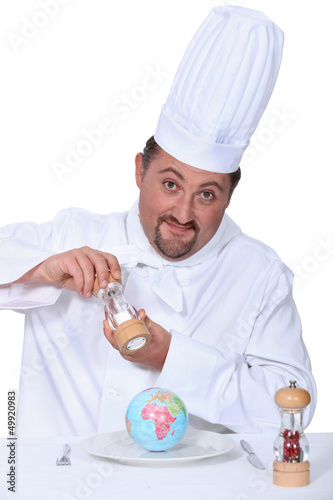 Photo: Chef seasoning a globe Chef seasoning a globe