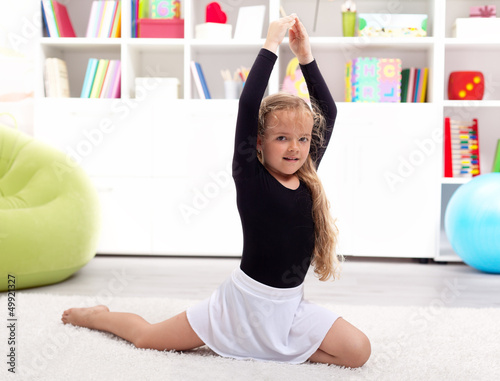 Photo: Little girl playing ballerina at home Little girl playing ballerina at home