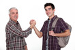 Experienced handyman greeting new starter