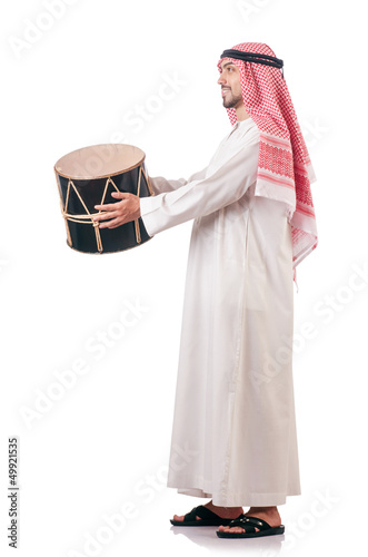 Photo: Arab man playing drum isolated on white Arab man playing drum isolated on white