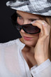 Woman wearing hat and sunglasses