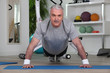 Photo: Mature man doing pushups Mature man doing pushups