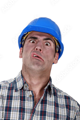 Photo: Portrait of grimacing worker Portrait of grimacing worker