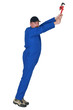 Man with wrench stretching