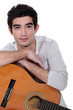A man with a guitar.