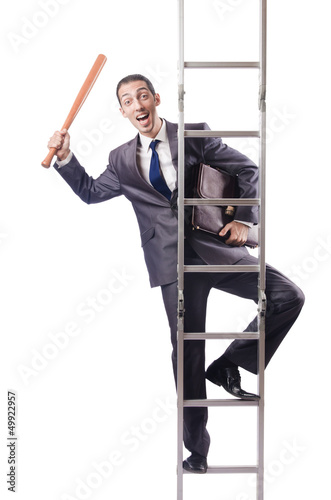 Photo: Businessman climbing the ladder isolated on white Businessman climbing the ladder isolated on white