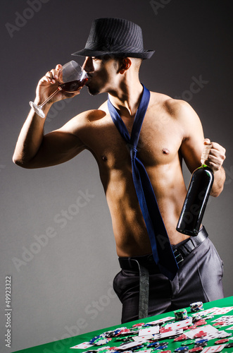 Photo: Naked broke businessman in casino Naked broke businessman in casino