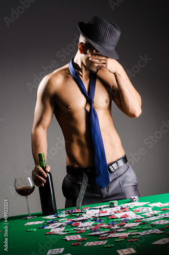 Photo: Naked broke businessman in casino Naked broke businessman in casino