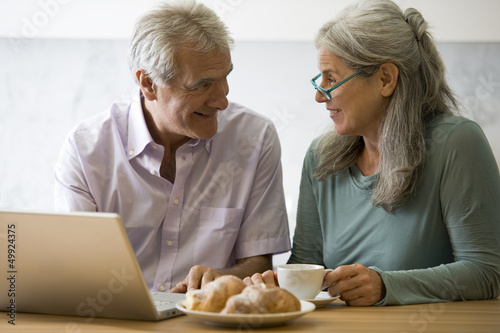 Photo: Mature couple at computer Mature couple at computer