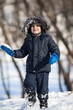 Cute boy playing with snow