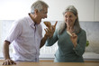 Mature couple eating snack food