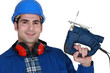 Builder with a jigsaw