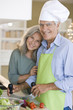 Mature couple preparing food