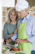 Mature couple preparing food