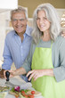 Mature couple preparing food