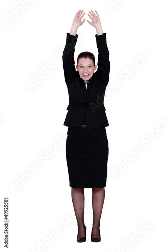 Photo: Businesswoman reaching up Businesswoman reaching up