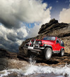 Offroad vehicle on the mountain terrain
