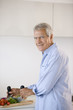 Mature man preparing food
