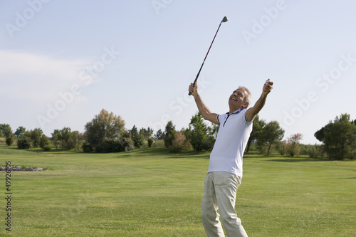 Photo: Mature man playing golf Mature man playing golf