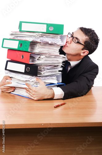 Photo: Young busy businessman at his desk Young busy businessman at his desk