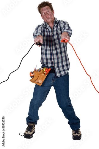 Photo: Man getting an electric shock from jump leads Man getting an electric shock from jump leads