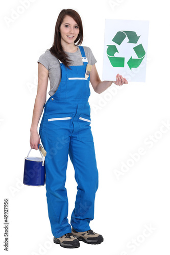 Photo: Female painter holding recycle logo Female painter holding recycle logo