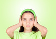 Photo: Frightened girl covering her ears Frightened girl covering her ears