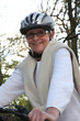Smiling senior woman on a bike