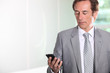 Businessman texting