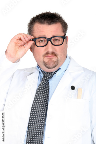 Photo: doctor putting on his glasses doctor putting on his glasses