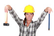Revolted woman looking at her tools