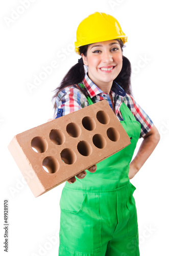 Photo: Woman builder with bricks on white Woman builder with bricks on white