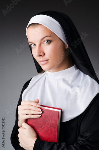 Photo: Young nun in religious concept Young nun in religious concept