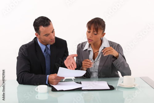 Photo: Business couple having heated discussion Business couple having heated discussion