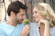 couple leaning on tree