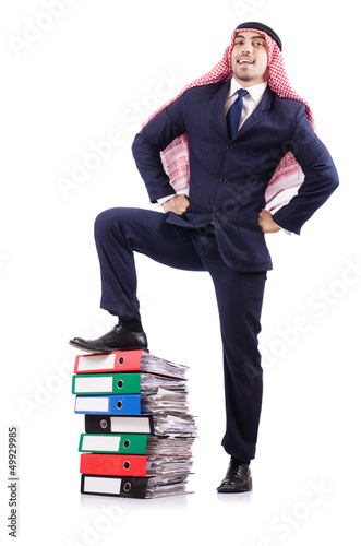 Photo: Arab businessman with many folders on white Arab businessman with many folders on white