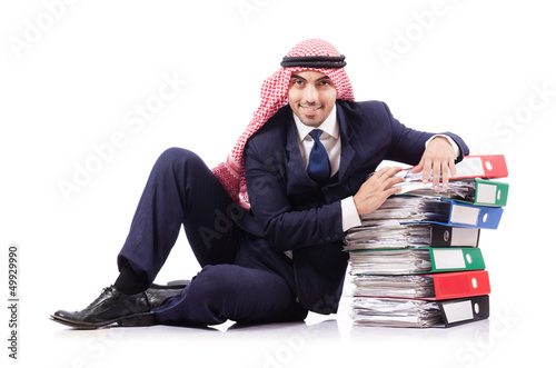 Photo: Arab businessman with many folders on white Arab businessman with many folders on white