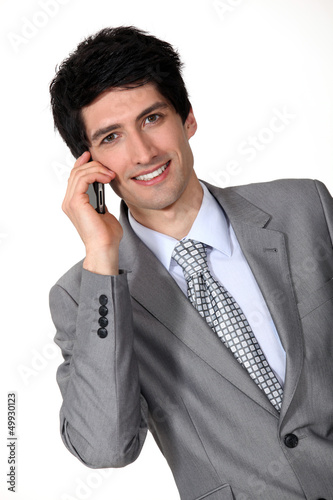Photo: Businessman man on cellphone Businessman man on cellphone