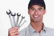 Man holding wrenches